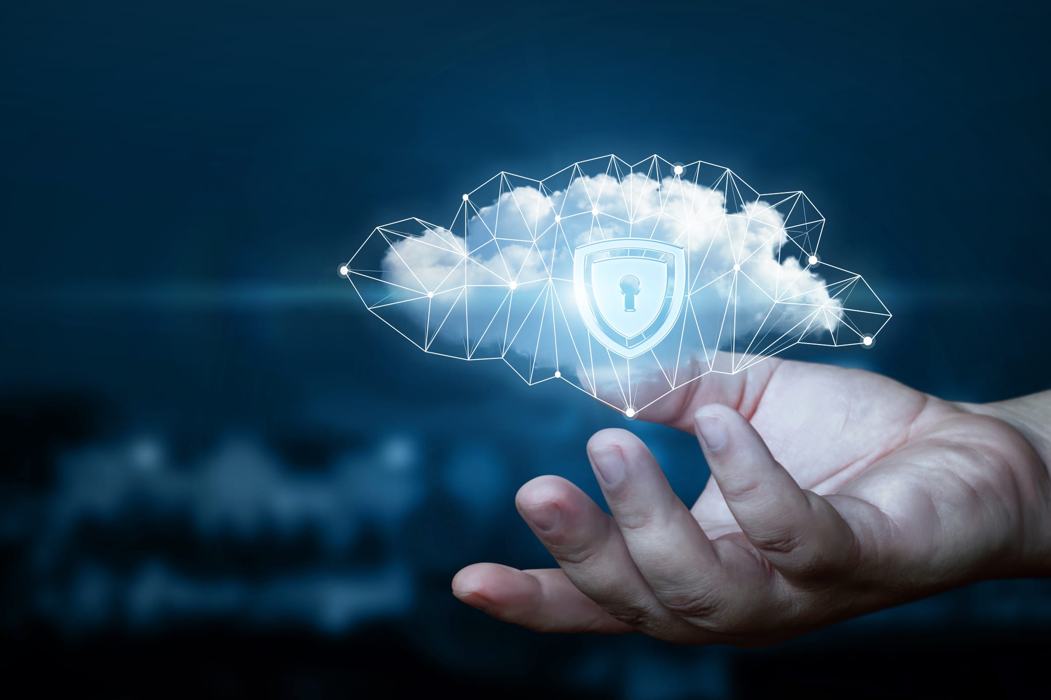 Hand shows a data cloud with a protective shield.